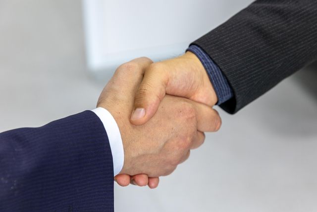 two%20people%20shaking%20hands two%20people%20shaking%20hands